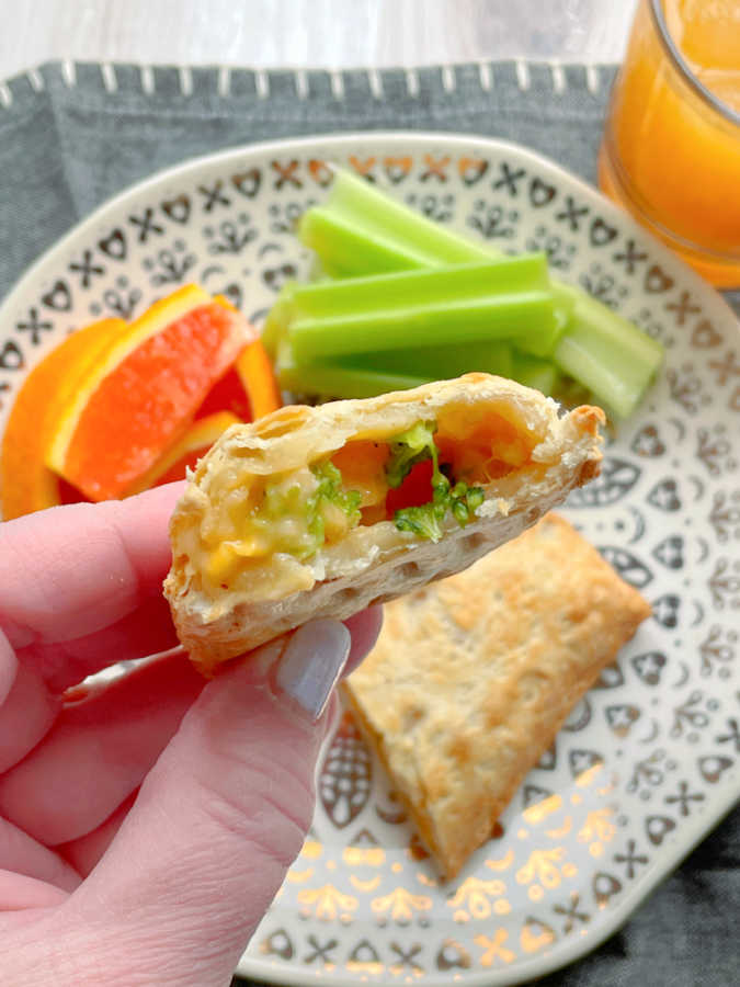 taking a bite of an air fryer hot pocket