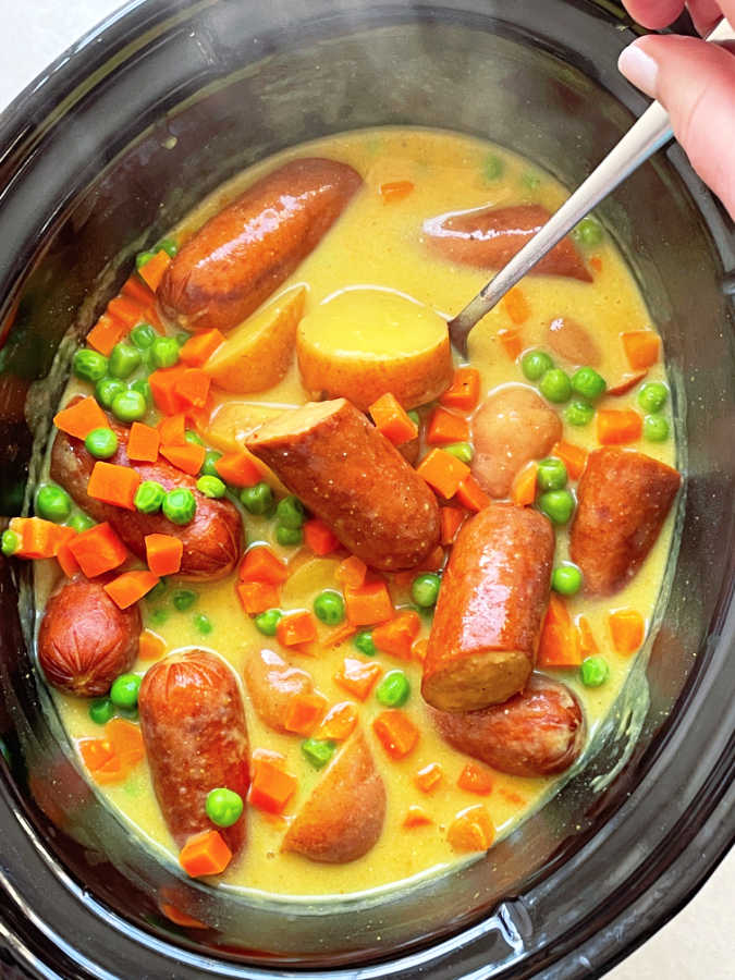 showing the curried sausage in the slow cooker