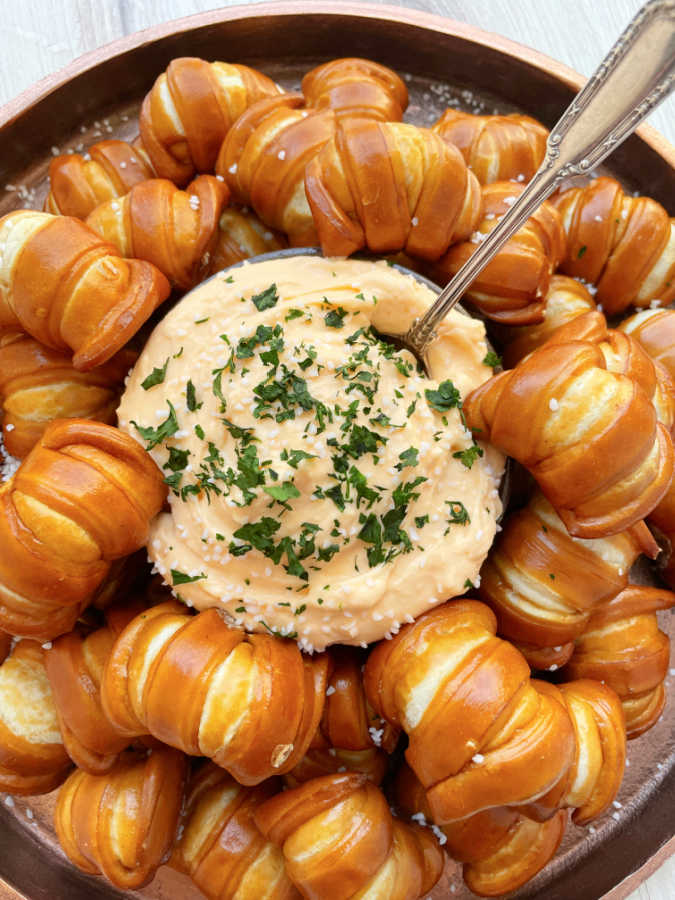 a platter of pretzel bites with pub cheese for dipping