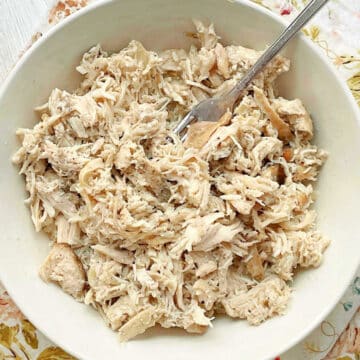crock pot cooked frozen chicken ready to eat and served in a bowl