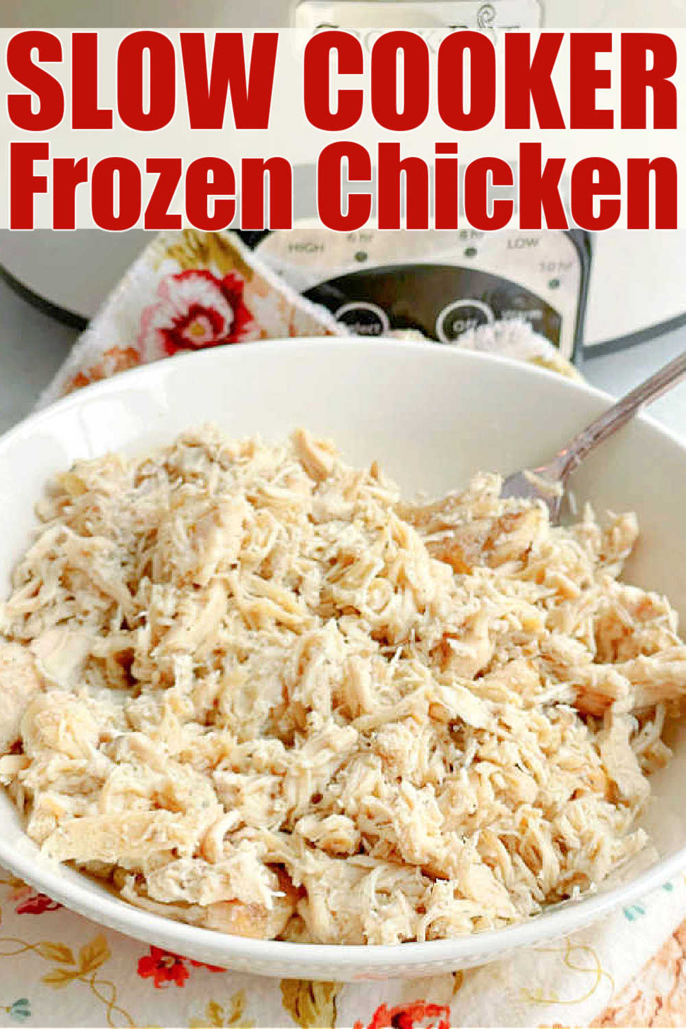 a bowl of cooked chicken sitting in front of the Crock-Pot it was cooked in