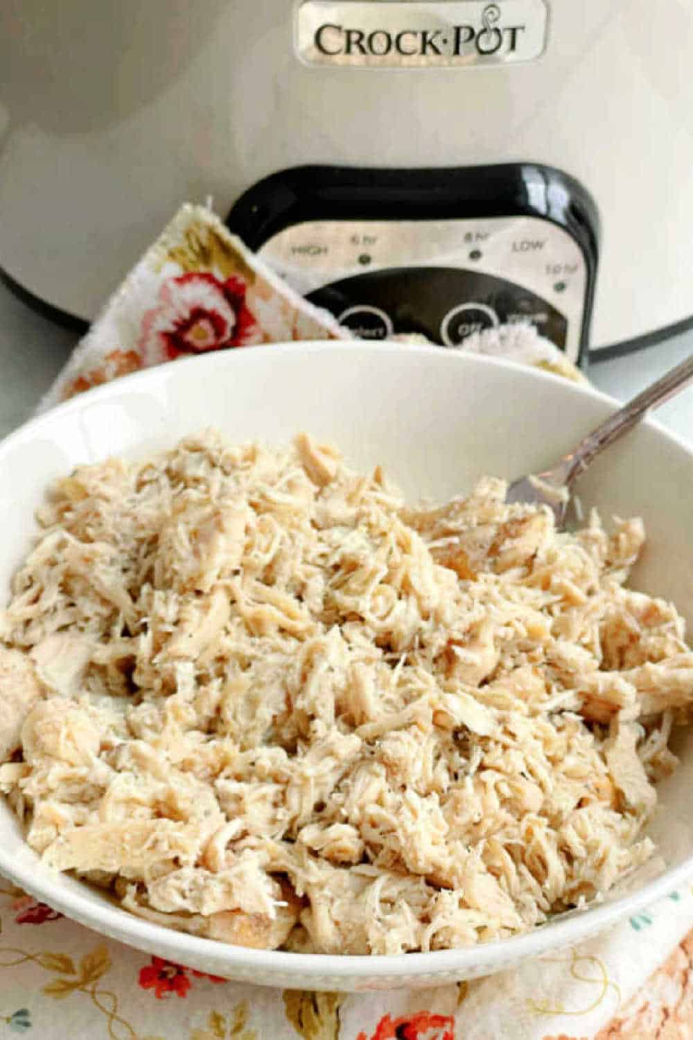 An easy recipe for making frozen, boneless and skinless chicken breasts in the Crock Pot to use in any recipe calling for cooked chicken. via @foodtasticmom
