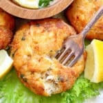 sticking a fork into a freshly air fried crab cake