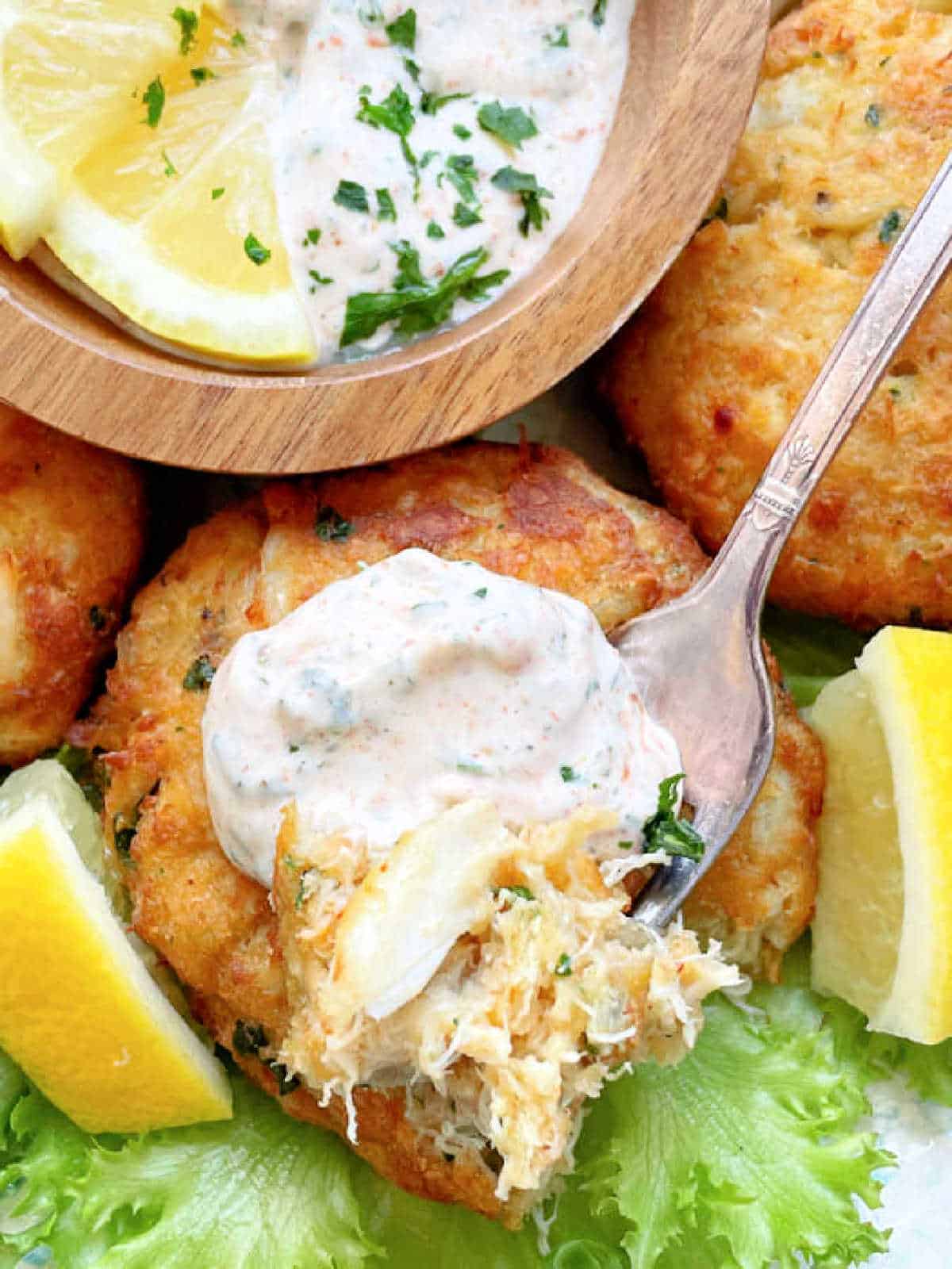 taking a bite of a delicious air fryer crab cake