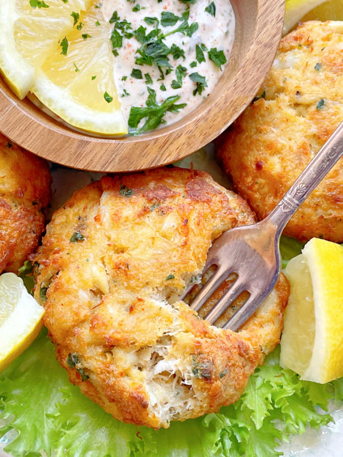 getting ready to take a bite of air fryer crab cakes