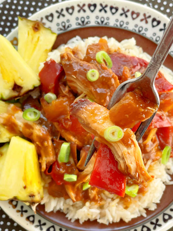 taking a bite of sweet Hawaiian crock pot chicken