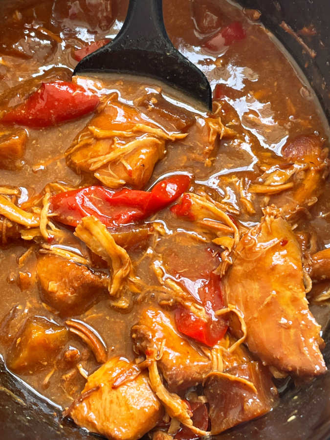 sweet Hawaiian crock pot chicken after being cooked in the crock pot insert