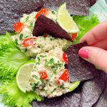 Mexican tuna salad plated with tortilla chips and lettuce leaves