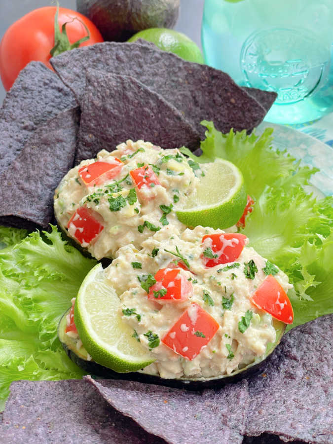 Mexican tuna salad plated with lettuce leaves and tortilla chips for dipping
