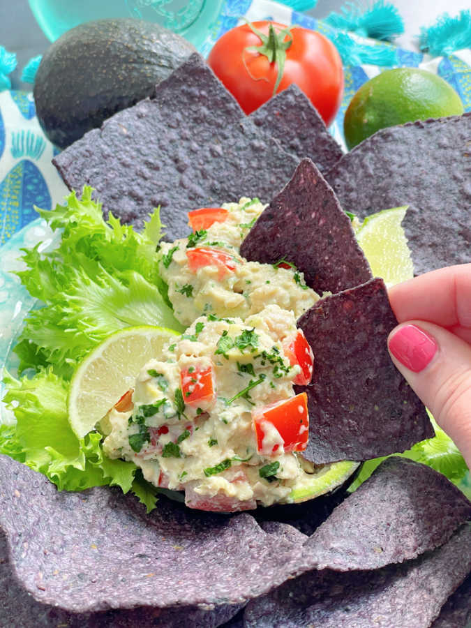 taking a bite of Mexican tuna salad