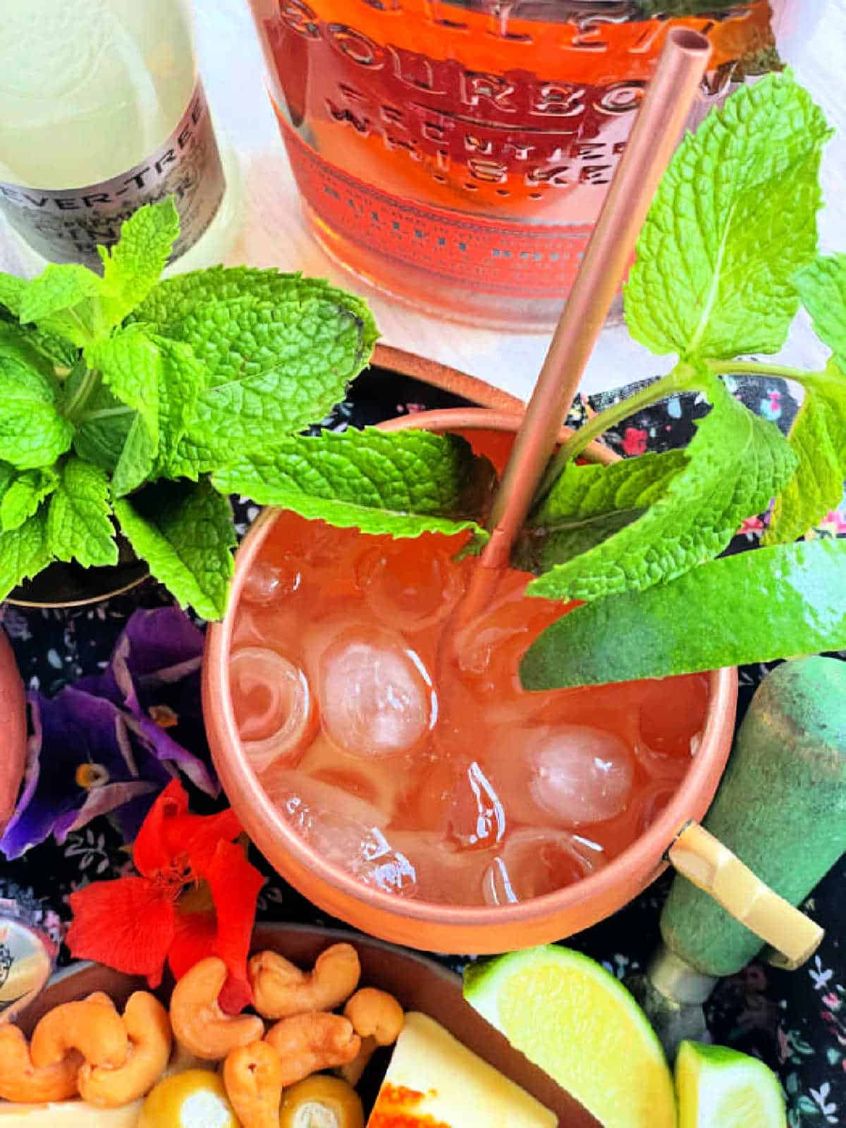 bourbon mule garnished with mint and lime