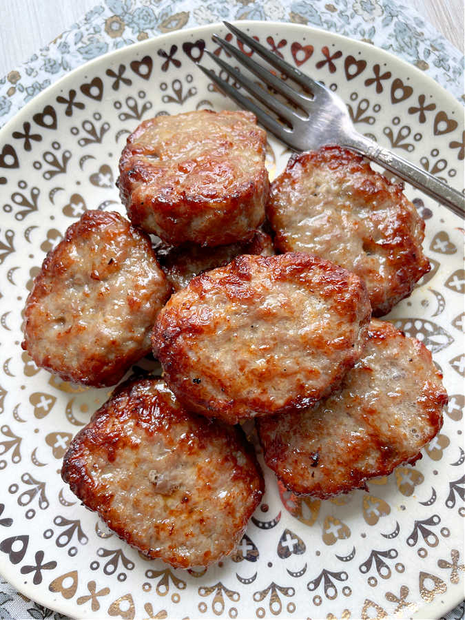plated breakfast sausage patties cooked perfectly in the air fryer