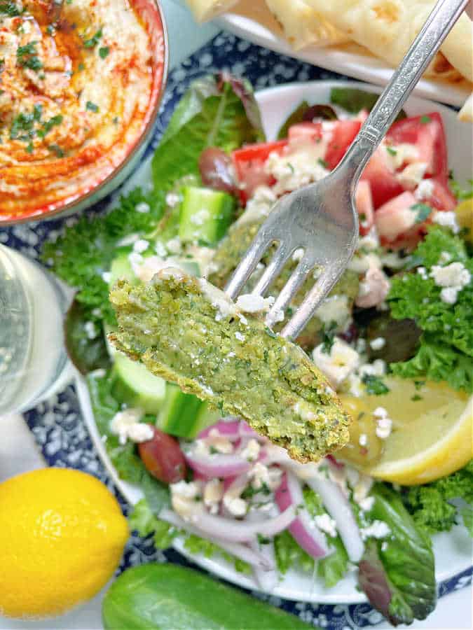 taking a bite of air fryer falafel