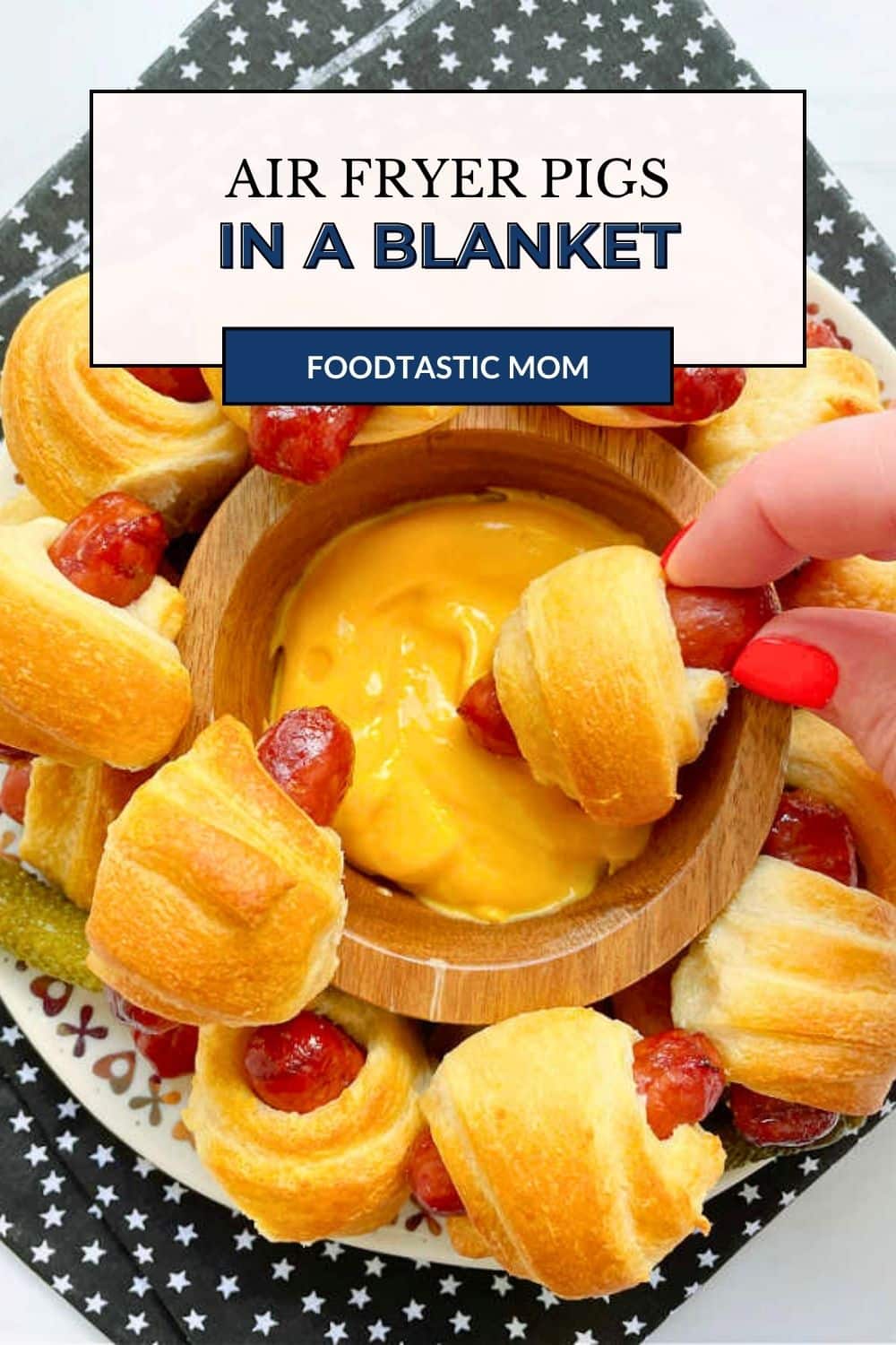 Air Fryer Pigs in a Blanket made with little smokies and crescent dough are a simple snack recipe for game days or an after school snack. via @foodtasticmom