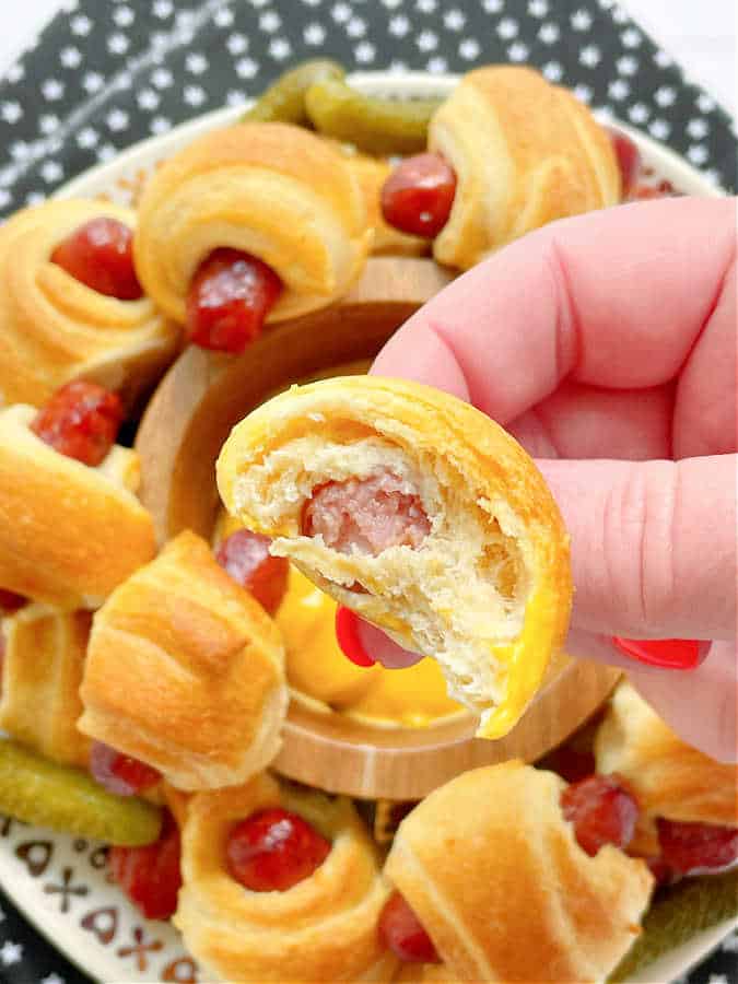 taking a bit of air fryer pigs in a blanket