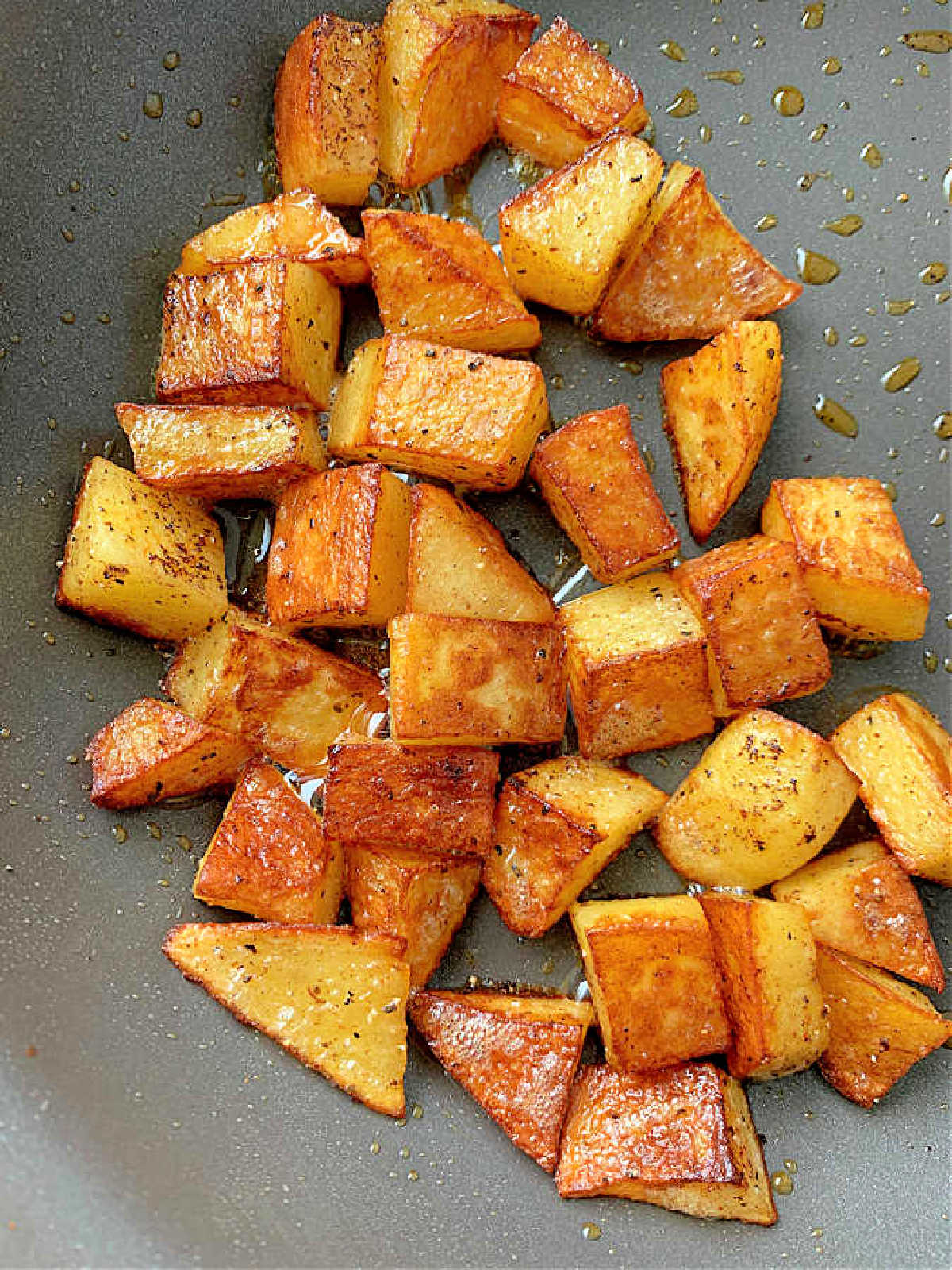 crispy browned breakfast potatoes in a nonstick skillet
