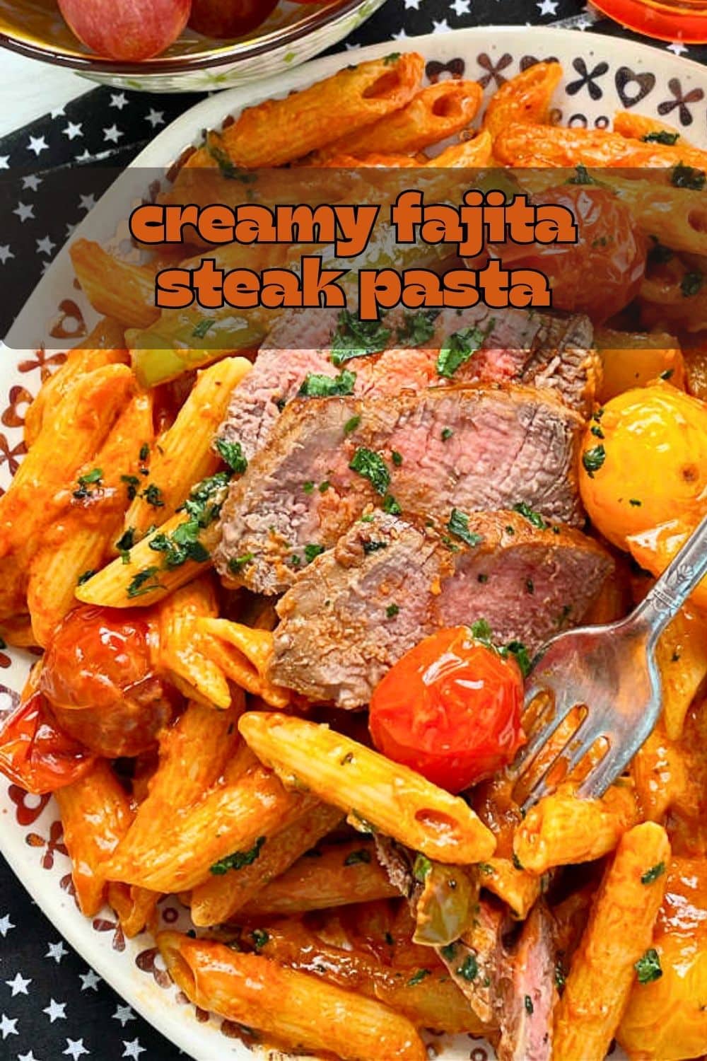 This steak pasta features perfectly cooked, Fajita-style steak on a bed of creamy penne pasta mixed with bell pepper, onions and burst cherry tomatoes. via @foodtasticmom