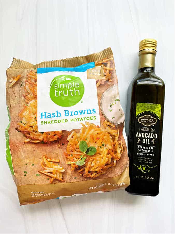 ingredients for making air fryer hashbrowns - shredded hash browns and avocado oil