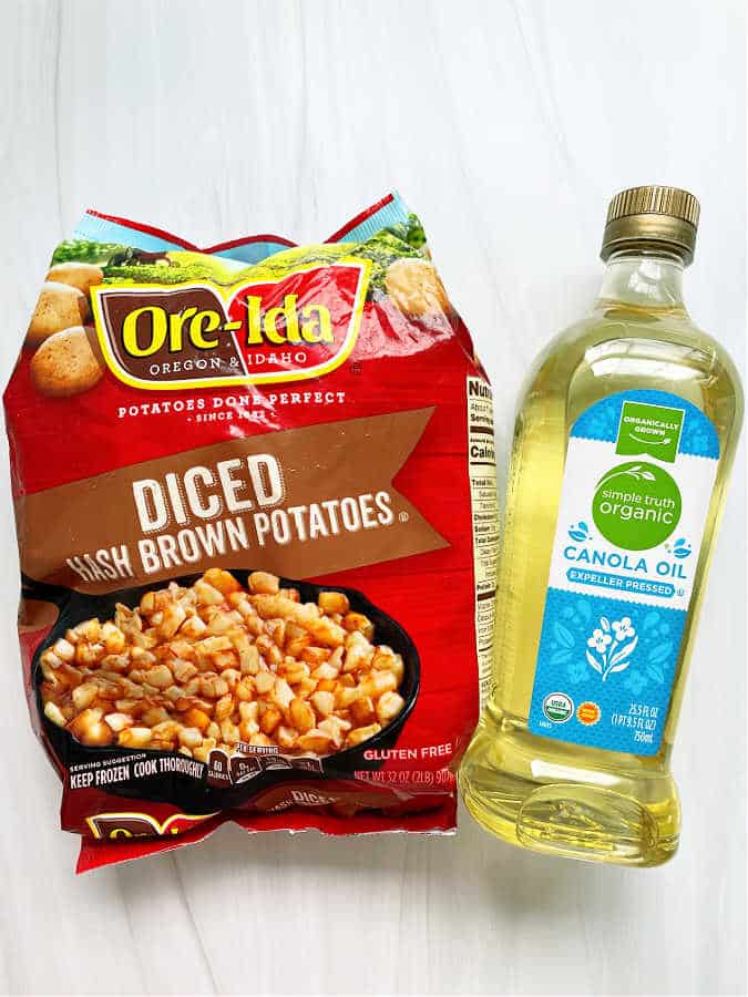 ingredients for making air fryer hashbrowns - diced hash brown potatoes and canola oil