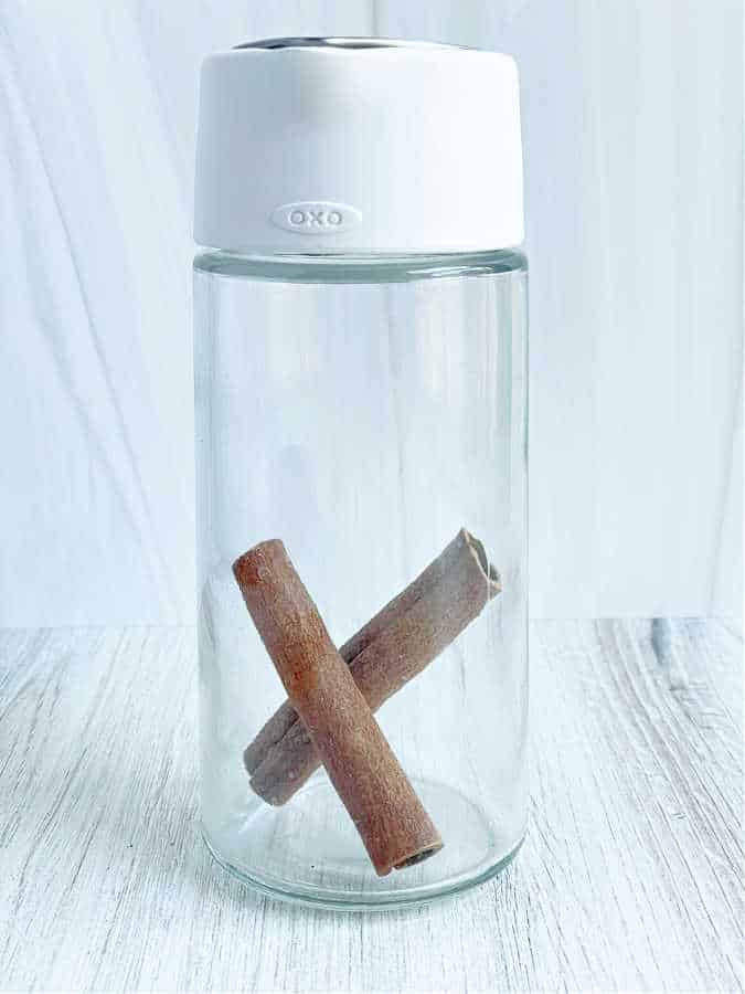 OXO Good Grips Glass Creamer with cinnamon sticks in it