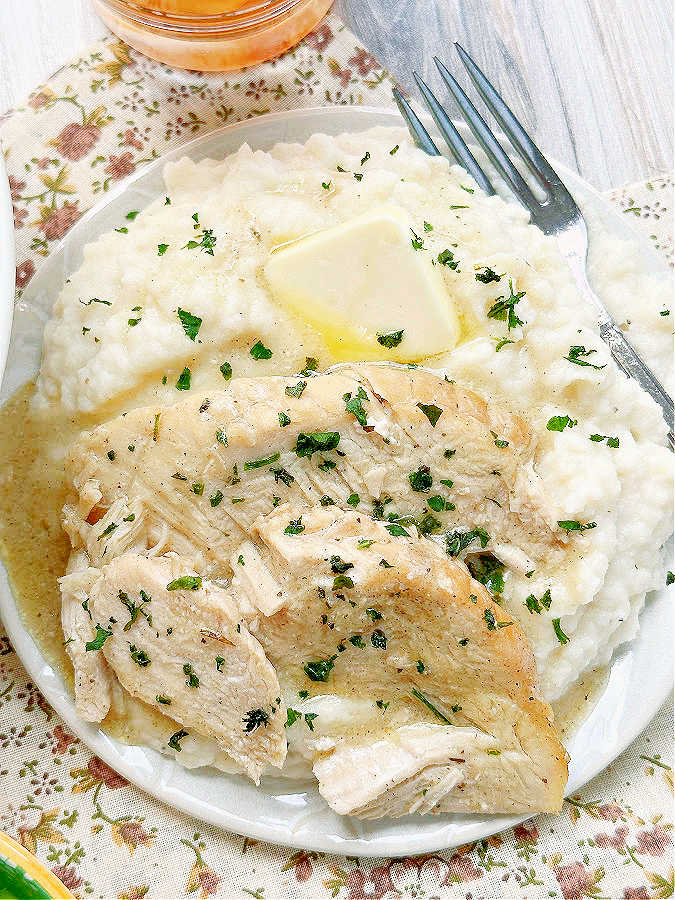 crock pot frozen turkey breast plated with mashed potatoes and gravy