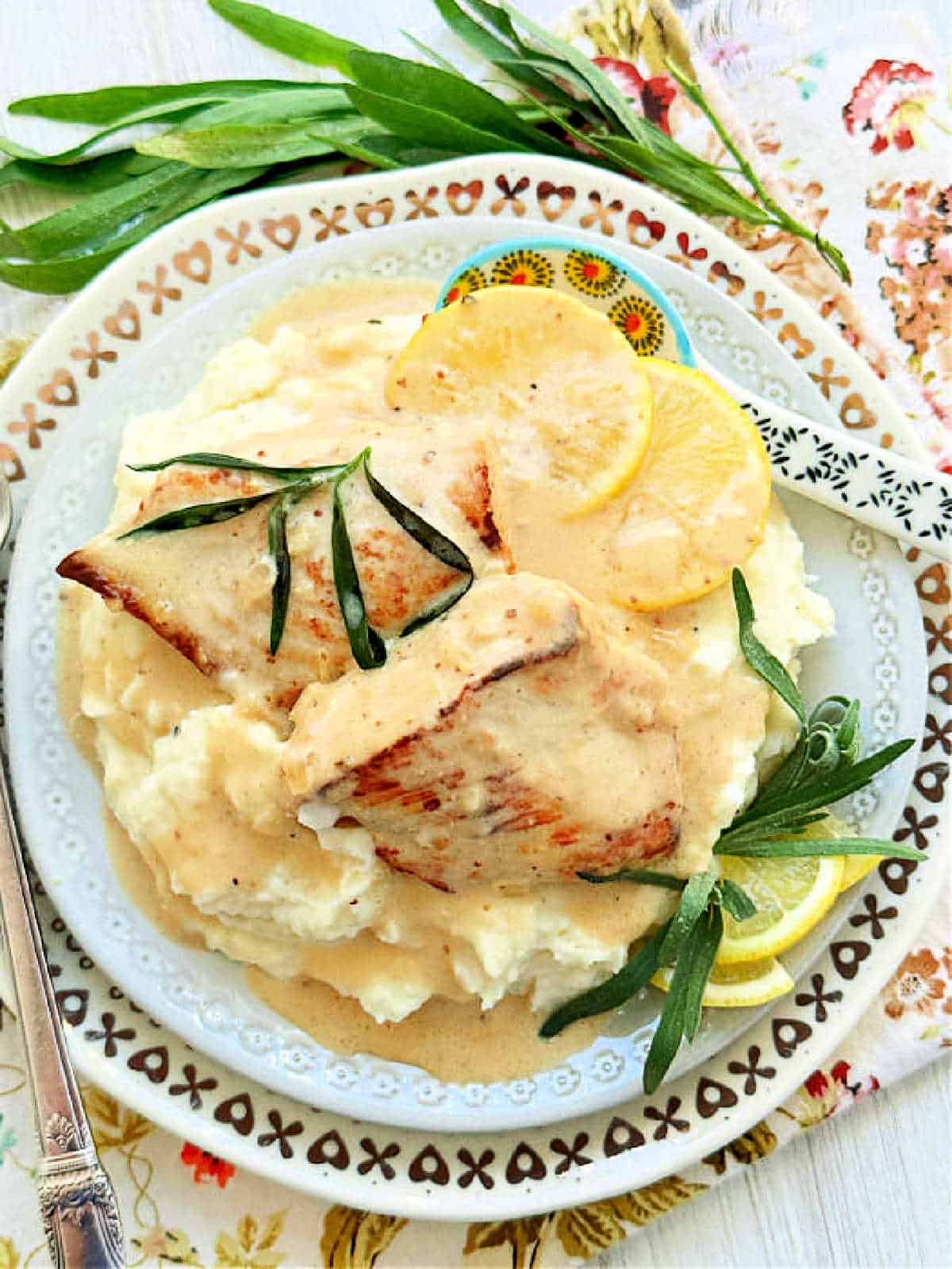 creamy lemon tarragon chicken plated with mashed potatoes