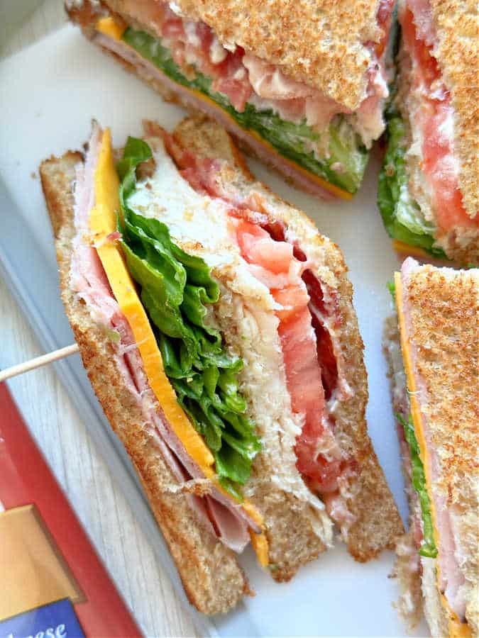 close up interior view of a freshly made clubhouse sandwich