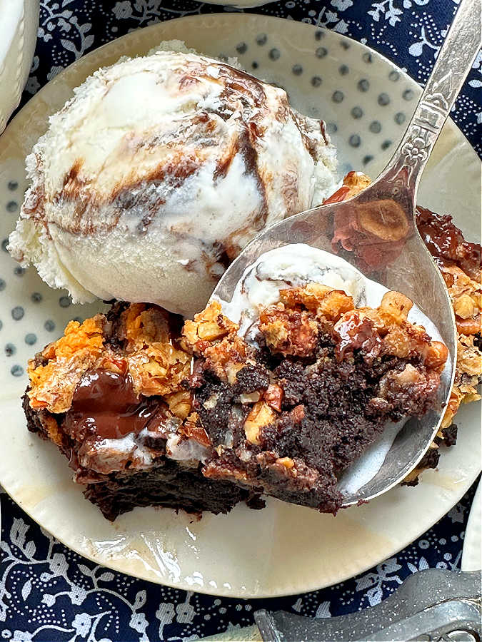 taking a bite of a condensed milk brownie with ice cream