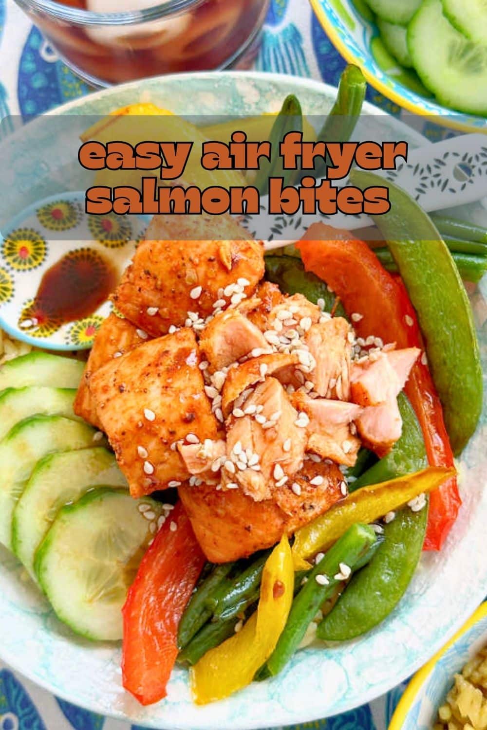 Tender air fryer salmon bites are seasoned with a simple spice rub and cook in just six minutes. Then drizzle them with your choice of sauce. via @foodtasticmom