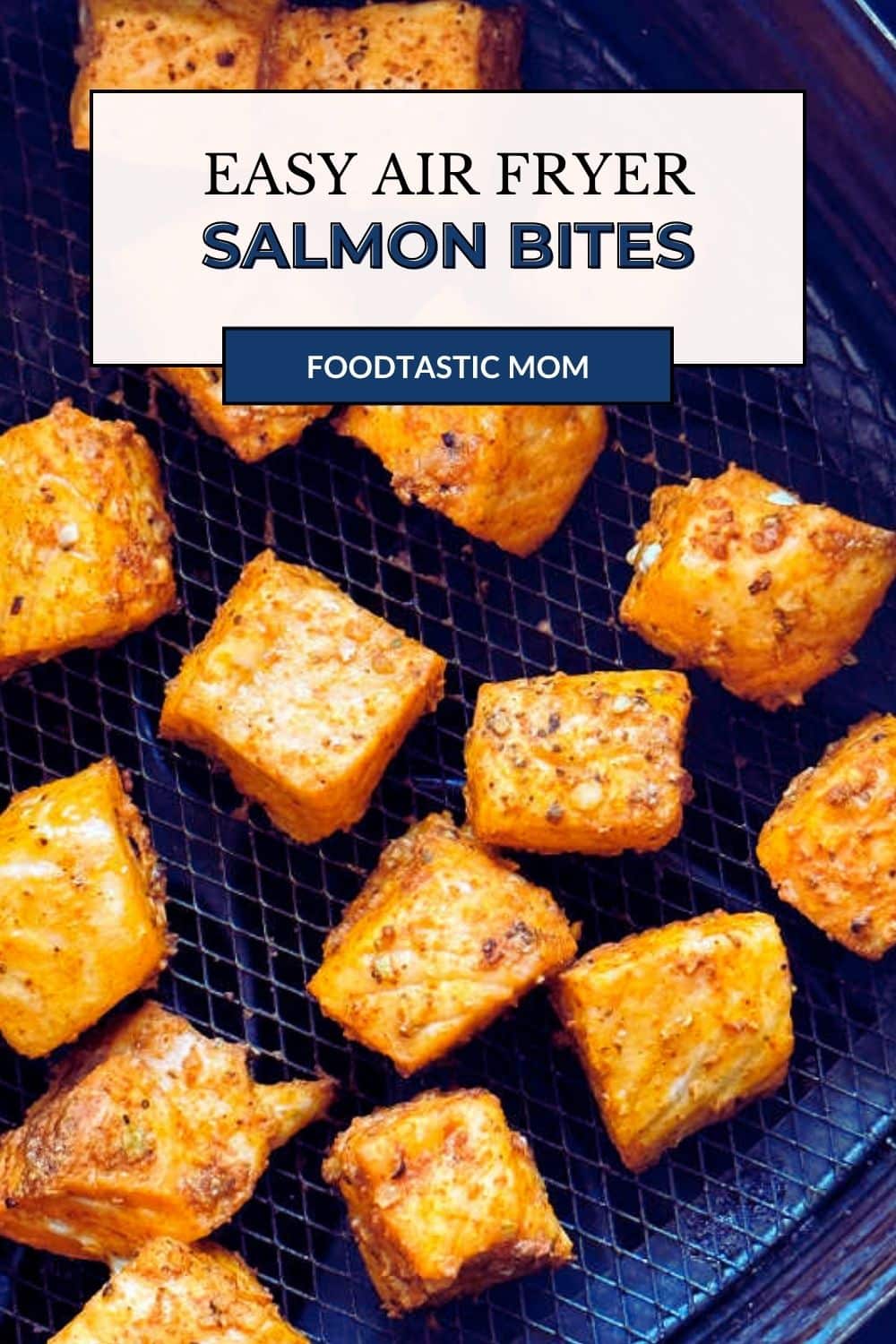 Tender air fryer salmon bites are seasoned with a simple spice rub and cook in just six minutes. Then drizzle them with your choice of sauce. via @foodtasticmom
