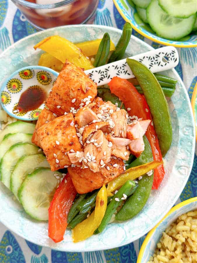 air fryer salmon bites bowl topped with the soy sesame honey glaze