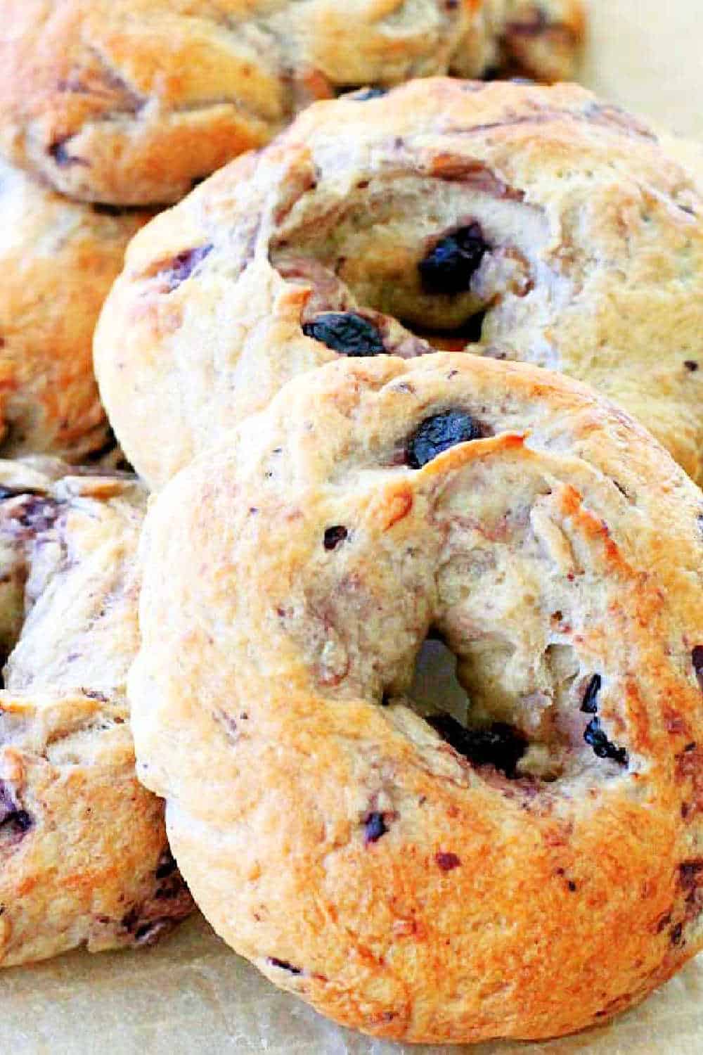 These Blueberry Bagels are a terrific weekend baking project. Bread and oat flours plus dried blueberries combine for dough that's easy to handle. via @foodtasticmom