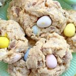 six mini egg cookies stacked on a jadeite plate