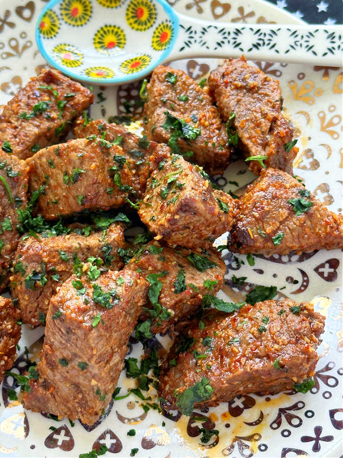 perfectly cooked air fryer steak bites on a plate