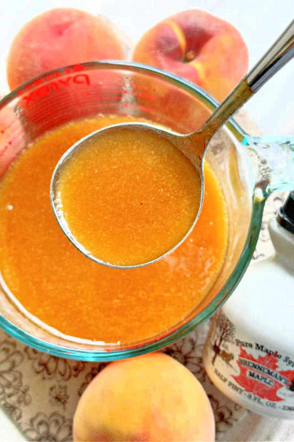 My homemade peach syrup recipe is delicious for topping pancakes and french toast. It can be made with fresh or frozen peaches. via @foodtasticmom