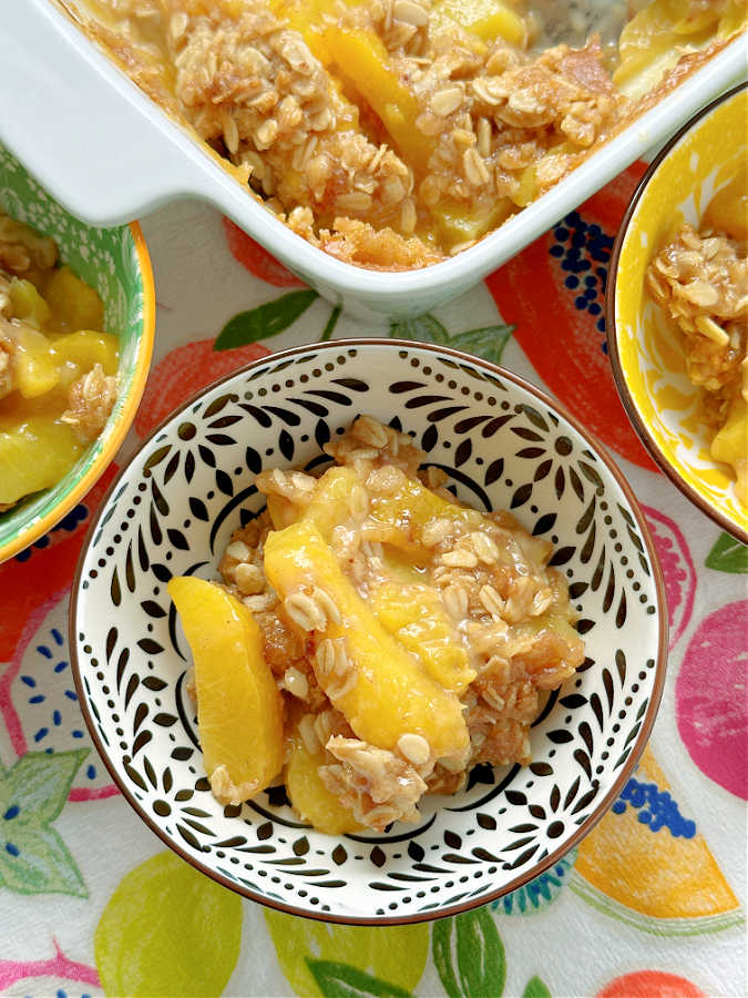 Bourbon Peach Crisp is the perfect dessert to show off the season's best peaches, kissed with bourbon and maple syrup flavor and the most delicious crumble topping. 