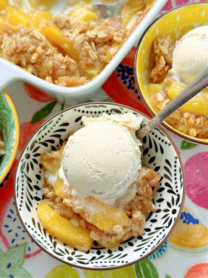 Bourbon Peach Crisp is the perfect dessert to show off the season's best peaches, kissed with bourbon and maple syrup flavor and the most delicious crumble topping. 