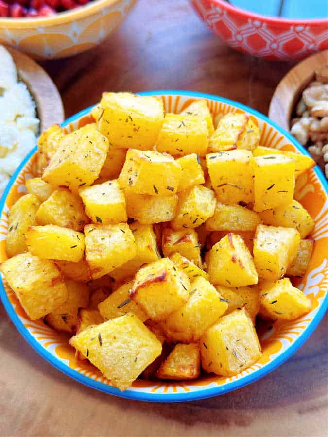 air-fried cubes of pumpkin in a decorative bowl