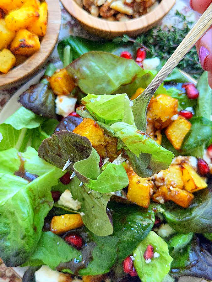 taking a bite of roast pumpkin salad