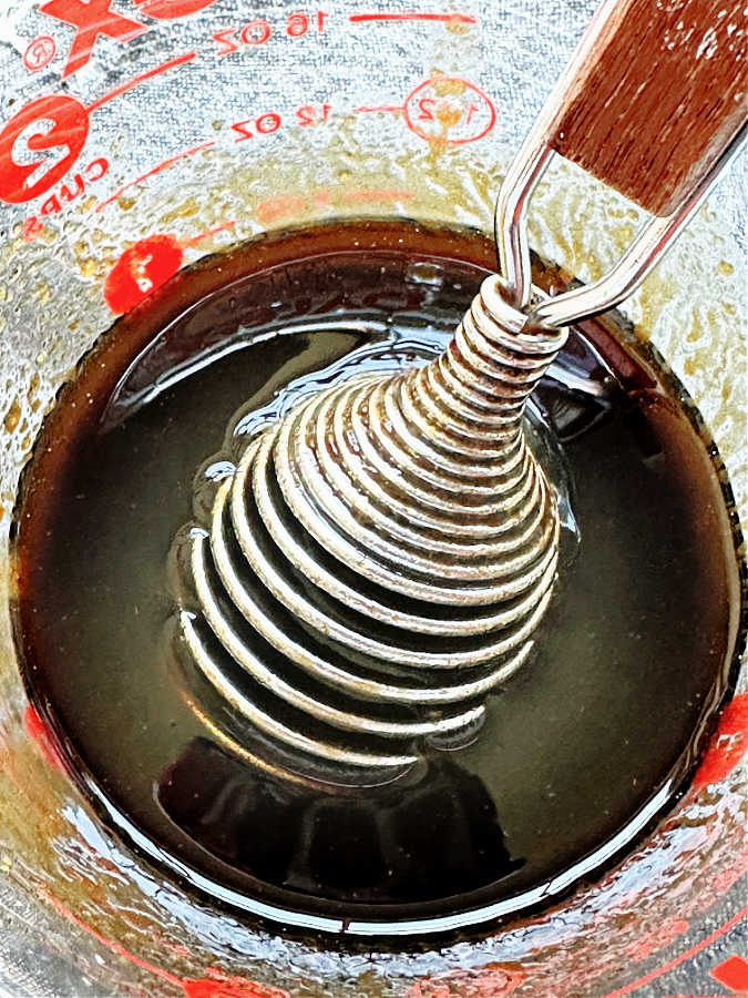 making the dressing for the roast pumpkin salad