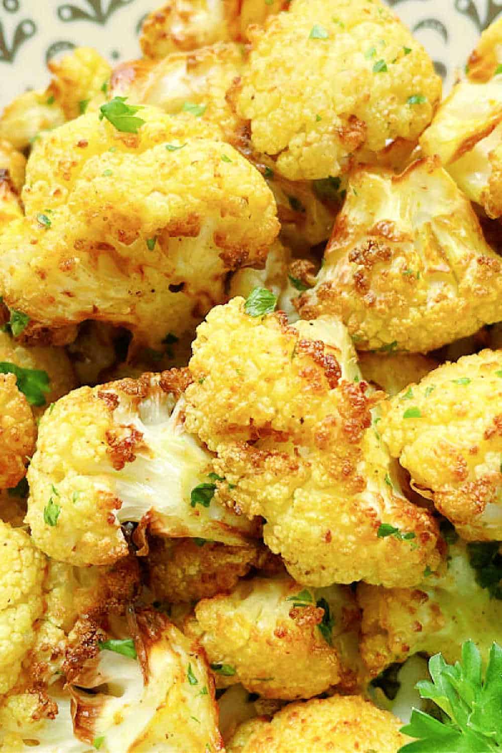 Air Fryer Cauliflower is such an easy side dish. Fresh cauliflower, a little curry powder and salt cook to perfect crispy tenderness. via @foodtasticmom
