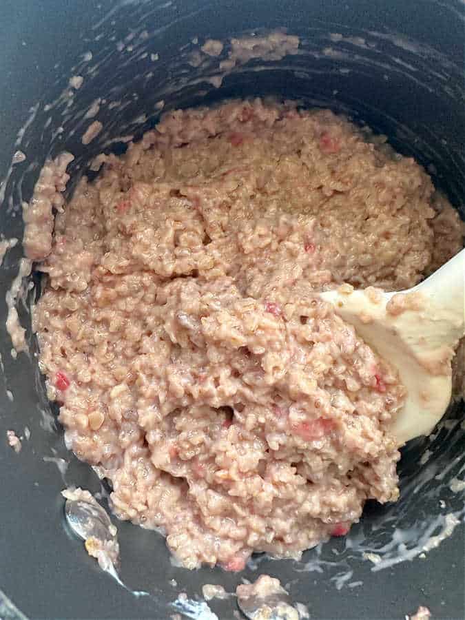 a batch of strawberry oatmeal cooked in a pot