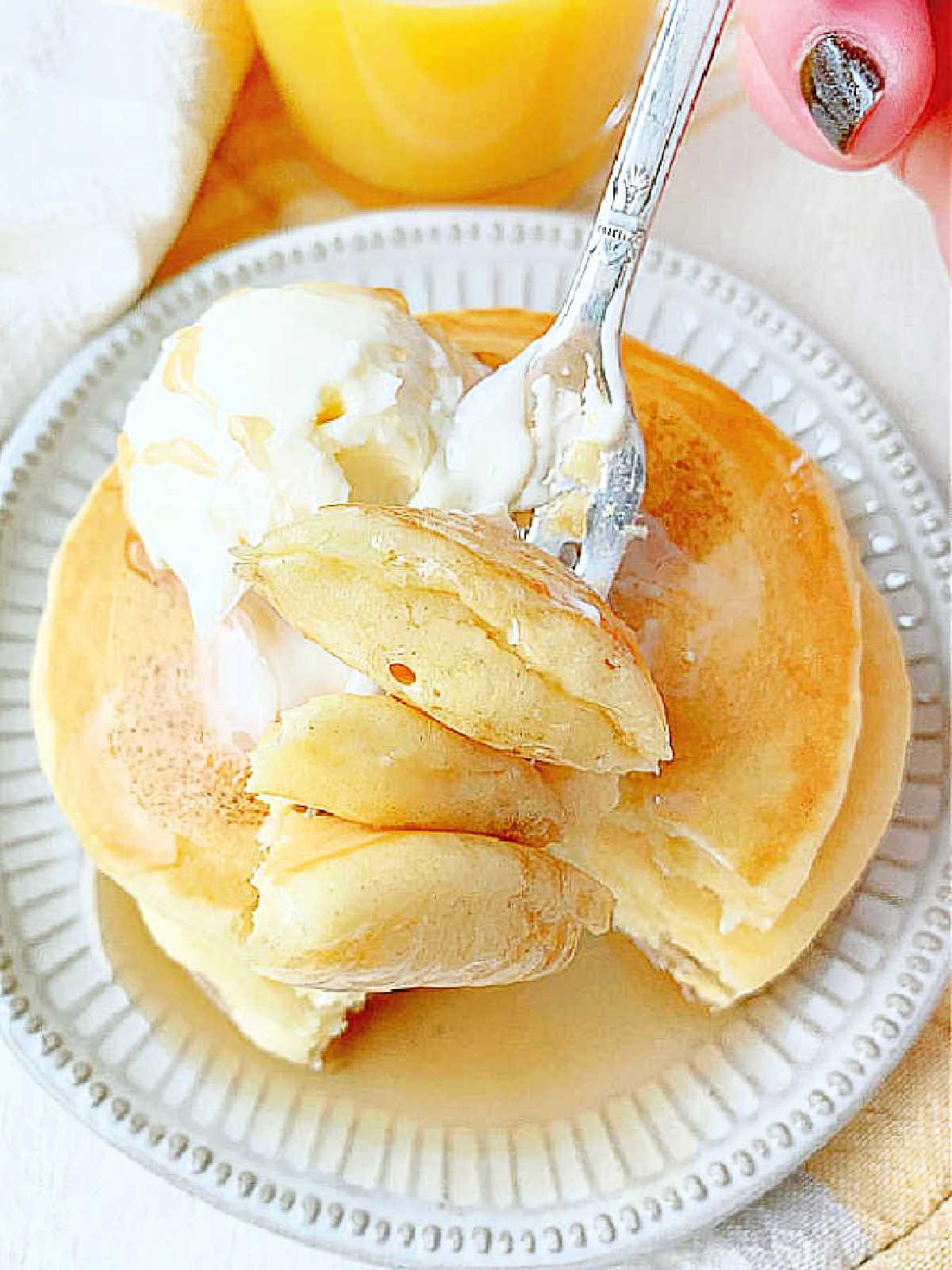 a forkful of pancakes ready to be eaten