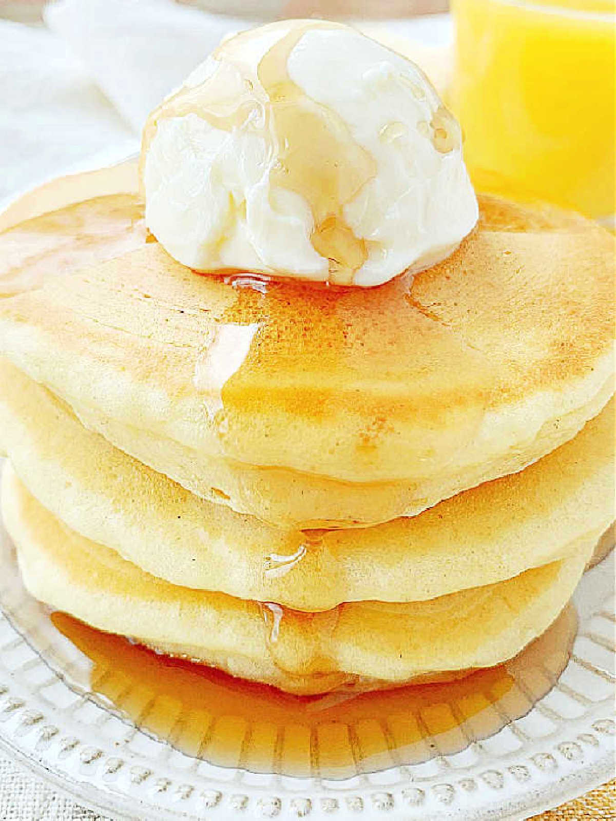 a plated stack of fluffy buttermilk pancakes