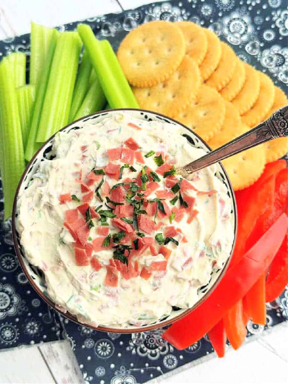 overhead view of dried beef dip with crackers and veggies