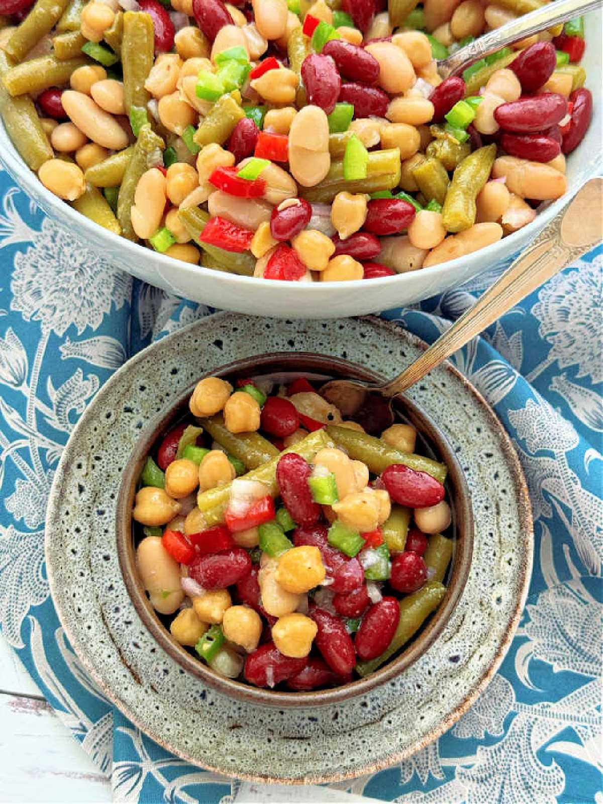 a smaller bowl of bean salad just served from the larger bowl