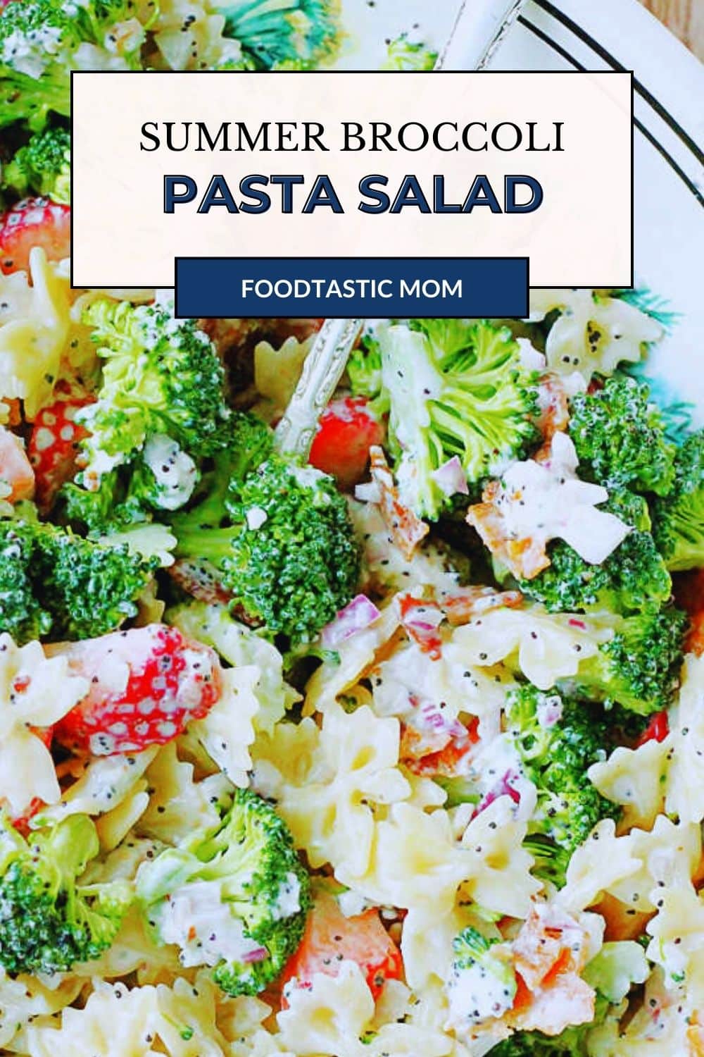 Summer Broccoli Pasta Salad is a terrific take-along dish with a perfect balance of sweet and savory flavors including strawberries and bacon. via @foodtasticmom