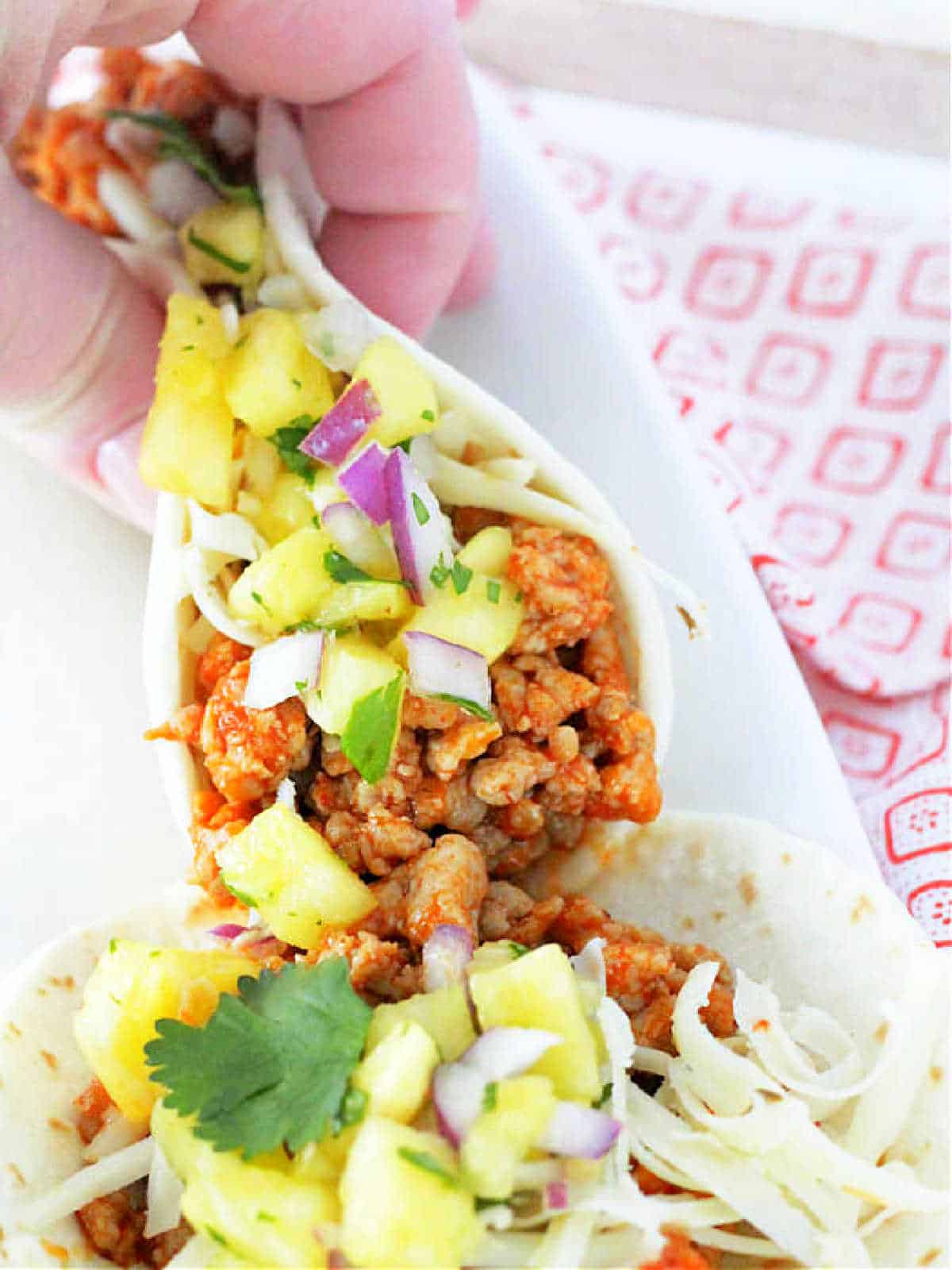holding a folded ground pork taco in my hand