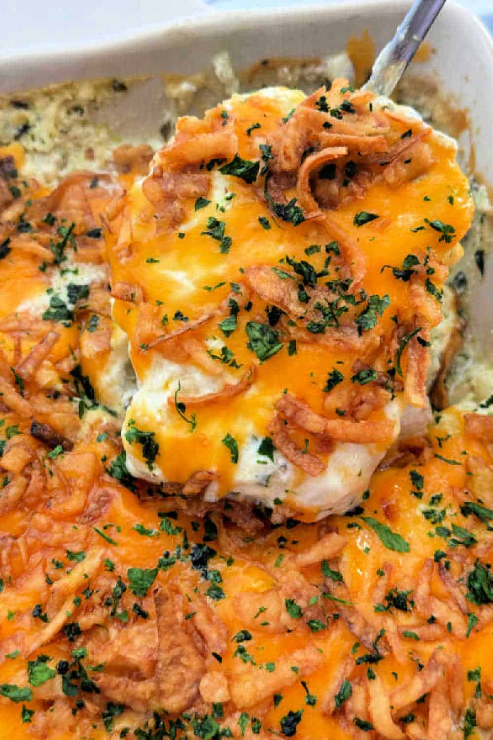 My pork chop casserole recipe layers boneless pork chops with potatoes in a luscious sour cream sauce. It's an easy and inexpensive dinner! via @foodtasticmom