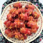 a plate full of bacon wrapped smokies ready to serve